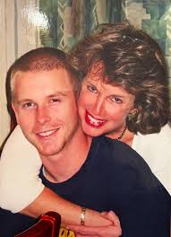 Remove glare and edge from photo of mom and brother