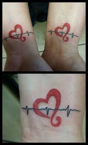 Mine And My Wife S Matching Tattoos This Is An Actual Ekg Of Our Actuak Heart Beat We Have The Same Heart Beat Ekg Tattoo Nurse Tattoo Heartbeat Tattoo