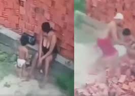 VIDEO: Mothers brave act saves child amidst falling bricks