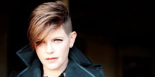 A woman removes hair on her head with an electric razor. Natalie Maines Q A On Fake Country Music Lesbian Hair Not Making Nice Pride Source