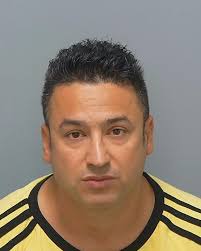 This is the face of a former 'carer of the year' who has fallen from grace  after being jailed for slapping and punching 'extremely vulnerable' elderly  care home patients. Farzad Sedigh-Rahnama targeted