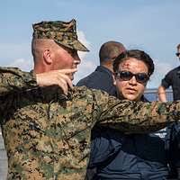 Gunnery Sergeant Derek Strasser (left), Administration