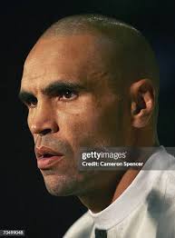 Les Mason of Australia stands