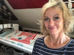 Scrappy gurlee quilt with happy panels