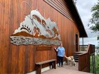 Outdoor Metal Wall Art with Fish, a Bear, and Fly Fishing
