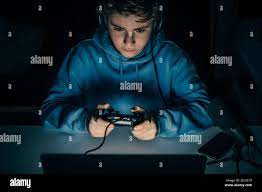 Young blogger and video game streamer playing at home with laptop. Vlogger  filming himself having fun using technology to connect with audiences.Teena  Stock Photo - Alamy
