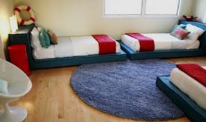 Balance and symmetry reign supreme in this shared boys' room. Three Kids Three Beds One Room