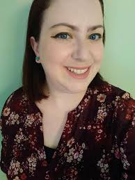 Girl wearing mini gold hoop earrings