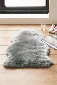 It is versatile to be draped across your favorite armchair, and will blend perfectly into any interior decor. Fluffy White Grey Faux Sheepskin Rug Large Super Size Eco Pelt Stunning Fur Uk Home Furniture Diy Hides Skins Faux Fur Rugs Redhot Cl