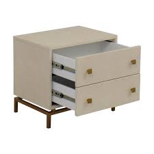 Everything from its textured shagreen finish, dramatic brass legs, and handles, to the drawers finished in cherry wood come together beautifully to provide elegance and contemporary style to your space. 22 Off Cb2 Cb2 Ivory Shagreen Embossed Nightstand Tables