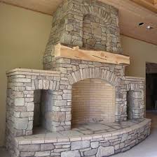 Fireplace With Built In Wood Storage Niches And Rough Hewn Mantle Wood Stove Fireplace Fireplace Built Ins House Exterior