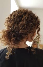 One with maybe a ballroom theme, complete with the ball gown. Untamed Tresses Naturally Curly Wedding Hairstyles