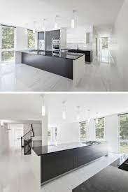 White and grey kitchens with dark floors and dark bedroom walls. The Dark Cabinetry And Kitchen Island Contrast With The White Walls And Marbled Floor Modern Kitchen Design Luxury Kitchen Design Kitchen Room Design