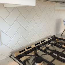3x6 White Subway Tile In A Herringbone Pattern With Light Gray Grout 3x6 White Subway Tile Kitchen Remodel White Subway Tile