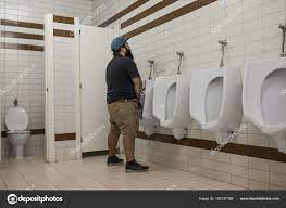 Man Beard Urinating Urinal Public Toilet Stock Photo by ©dfuentesphotostock  197237168