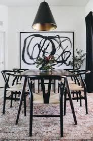 The charming cowhide rug on the floor and the ones on the chairs are just so pretty. Modern Dining Room Reveal Within The Grove European Home Decor Home Decor Modern Dining Room