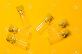 Empty Little Bottles With Cork Stopper Isolated On Yellow Glass Stock Photo Picture And Royalty Free Image Image 129102174