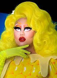 A drag queen or a drag king is a person (male or female) who adopts a costume and a persona and performs on stage as a singer, a comedian, or other character. Kim Chi Drag Queen Wikipedia