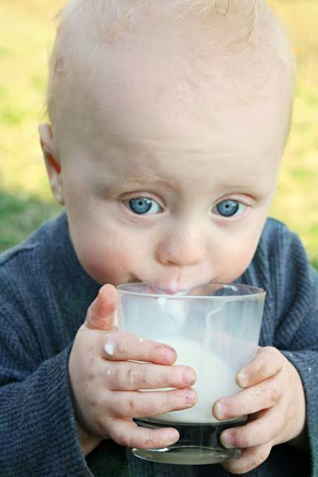 Baby Drinking Milk stock image. Image of blonde, glass - 32689241