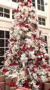The Perfect Flocked Tree With All The Red Trimmings Rachel Parcell Style Flocked Christmas Trees Decorated Frosted Christmas Tree White Flocked Christmas Tree