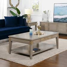 Here's where to buy her exact coffee table. Dauphin 50 Rectangular Storage Coffee Table By Jennifer Taylor Home Overstock 32168482