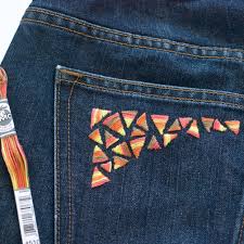 Drawing jeans involves outlining a basic pair of pants and adding specific jean details, such as the pocket shapes, the buttons, the snaps and the stitched s. A Guide For Hand Embroidery On Denim
