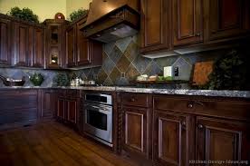 Kitchen Idea Of The Day Traditional Dark Cherry Stained Kitchens Love The Backsplash O Dark Wood Kitchens Cherry Cabinets Kitchen Kitchen Inspiration Design