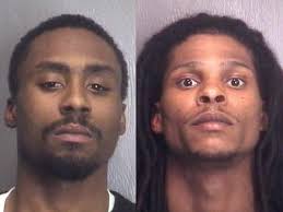 Two charged in armed robbery