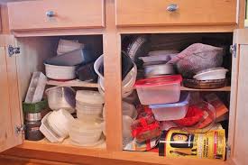13 Clever Ways To Get Your Tupperware Collection Under Control Tupperware Organizing Kitchen Cabinet Storage Kitchen Cabinets Decor