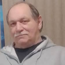 How do rescuers save money to purchase or build a kennel property?