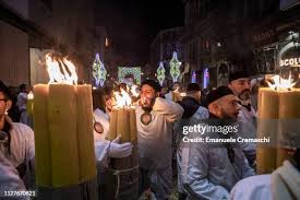 The float containing the relics of Saint Agatha is surrounded by... News  Photo