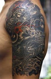 Simbolos tattoo body art tattoos small tattoos tattoos for guys tatoos rune symbols alphabet symbols magic symbols glyphs symbols. Black And Grey Dragon Quarter Sleeve By Troy Denning Tattoonow