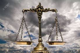Lady justice holds the sword higher than the scales of justice. A Photo Of The Scales Of Justice With A Balance Theme Overlay Stock Photo Picture And Royalty Free Image Image 9135841