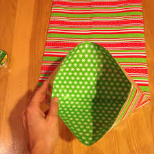 Fold the sides of the wrapper. How To Make A Gift Bag Out Of Wrapping Paper Happy Wifestyle