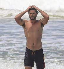 Liam Hemsworth Looks Hot Shirtless On A Beach - Gay-Male-Celebs.com