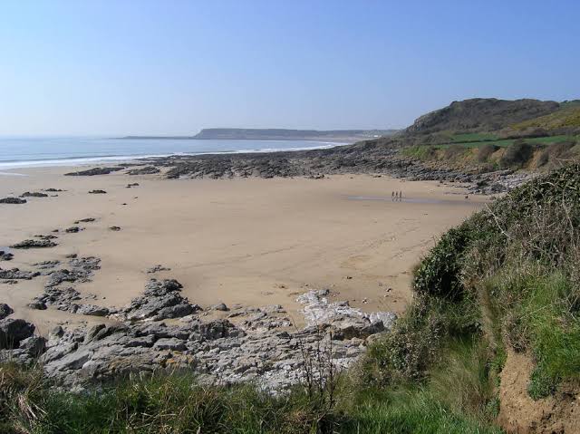 The secluded sands of Slade Bay, AI generated