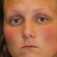 Police: Woman arrested after punching man in the face