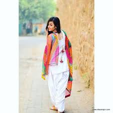 The kameez has a high black collar, 3 white lace patterns near the chest, similar to buttons. 22 Latest Punjabi Suits Party Wear In 2019