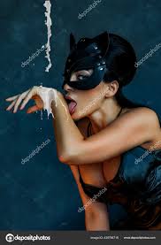 Sexy girl in leather bdsm cat mask licks milk Stock Photo by  ©babyd2@mail.ru 425766716