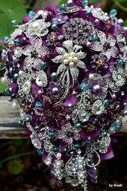 The coral and turquoise just happen to pair amazing together, these two bright hues are fun and coordinate well with a light grey to balance out the palette. 20 Chic Brooch Wedding Bouquets With Diy Tutorial Deer Pearl Flowers