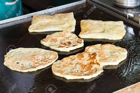 Its a platform where you can share your traveling experience & exploring good food with all. Close Up Of Pan Fry Indian Flat Bread Roti Canai In The Hawker Stock Photo Picture And Royalty Free Image Image 89179962