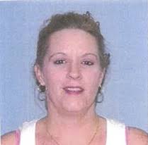 Woman, 70, found 'strangled to death with belt' and buried in concrete in  her basement as cops track down caregiver