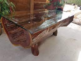 Tops with medium brown color and embossed, hexagonal pattern, emphasized with a whitewash finish. Half Log Cedar Coffee Table Fine Wood Carvings