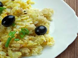 A classic recipe in portugal, this bacalhau a bras combines scrambled eggs filled with fried potatoes and shards of salt cod. Where To Eat The Best Bacalhau A Bras In Lisbon District Tasteatlas