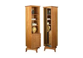 Decorate the four adjustable shelves and place dishes, blankets, or seasonal items on the two extra shelves hiding behind the two doors. Sarita Swivel Bookcase Hardwood Artisans Handcrafted Office Furniture