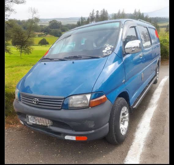 The iconic 2004 Toyota HiAce SBV XH10 Series, widely recognized as the Dolphin model in Addis Ababa., AI generated