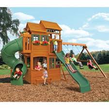 Sand box with a swing set ladder and climbing wall to reach the raised, rectangular play fort with tarp canopy. Kenz 2nd Birthday This Year Costco Cedar Summit Shelbyville Deluxe Playset Big Backyard Wooden Playset Backyard Play