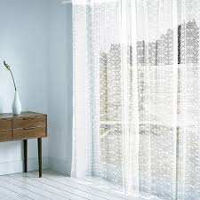 The impressionistic floral pattern features soft tones of yellow, rust, blue, melon and green. Timeless White Sheer Curtain With Delicate Floral Patterns