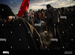 Cannonball, North Dakota, USA. 24th Nov, 2016. MARK LESSER of Minot, North  Dakota spreads sage smoke