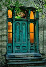 victorian era aged turquoise door with sidelights looks like a london build warm lighting inside on an early winte turquoise door gorgeous doors unique doors